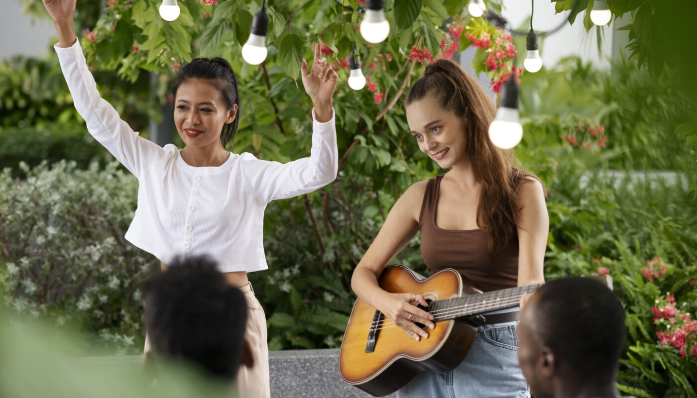 https://www.freepik.com/free-photo/medium-shot-smiley-woman-playing-guitar_26411858.htm#fromView=search&page=1&position=25&uuid=f2d1f3ad-f53a-4eb5-a98d-b8eb38f8886e&query=Family-Friendly+Festivals+That+Combine+Culture+%26+Fun