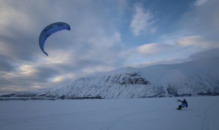https://www.pexels.com/photo/person-snowkiting-near-a-mountain-11302806/