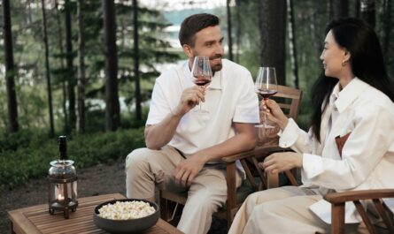 https://www.pexels.com/photo/a-couple-sitting-on-wooden-chairs-holding-glasses-of-wine-8845115/